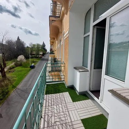 Balconies Above Colonnade Apartment